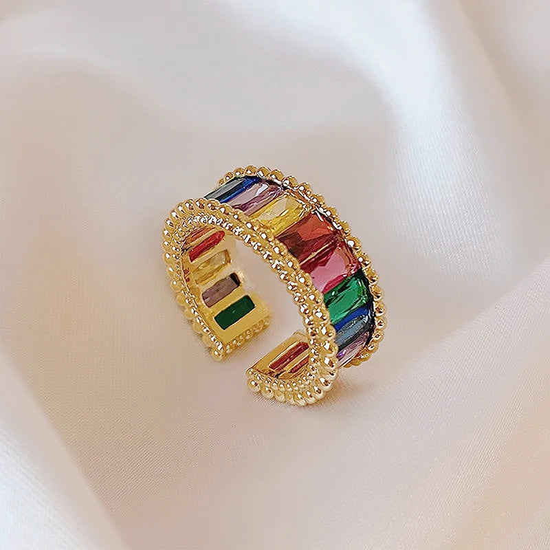Sparkling zirconia rainbow ring with index finger